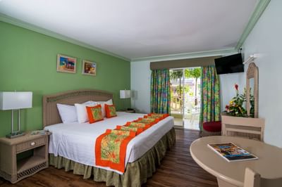 Comfy bed & mirror table with a patio in Studio Family at Dover Beach Hotel
