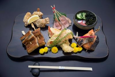 Elegant platter of assorted Japanese skewers, tempura, and fresh veggies at The Saujana Hotel Kuala Lumpur