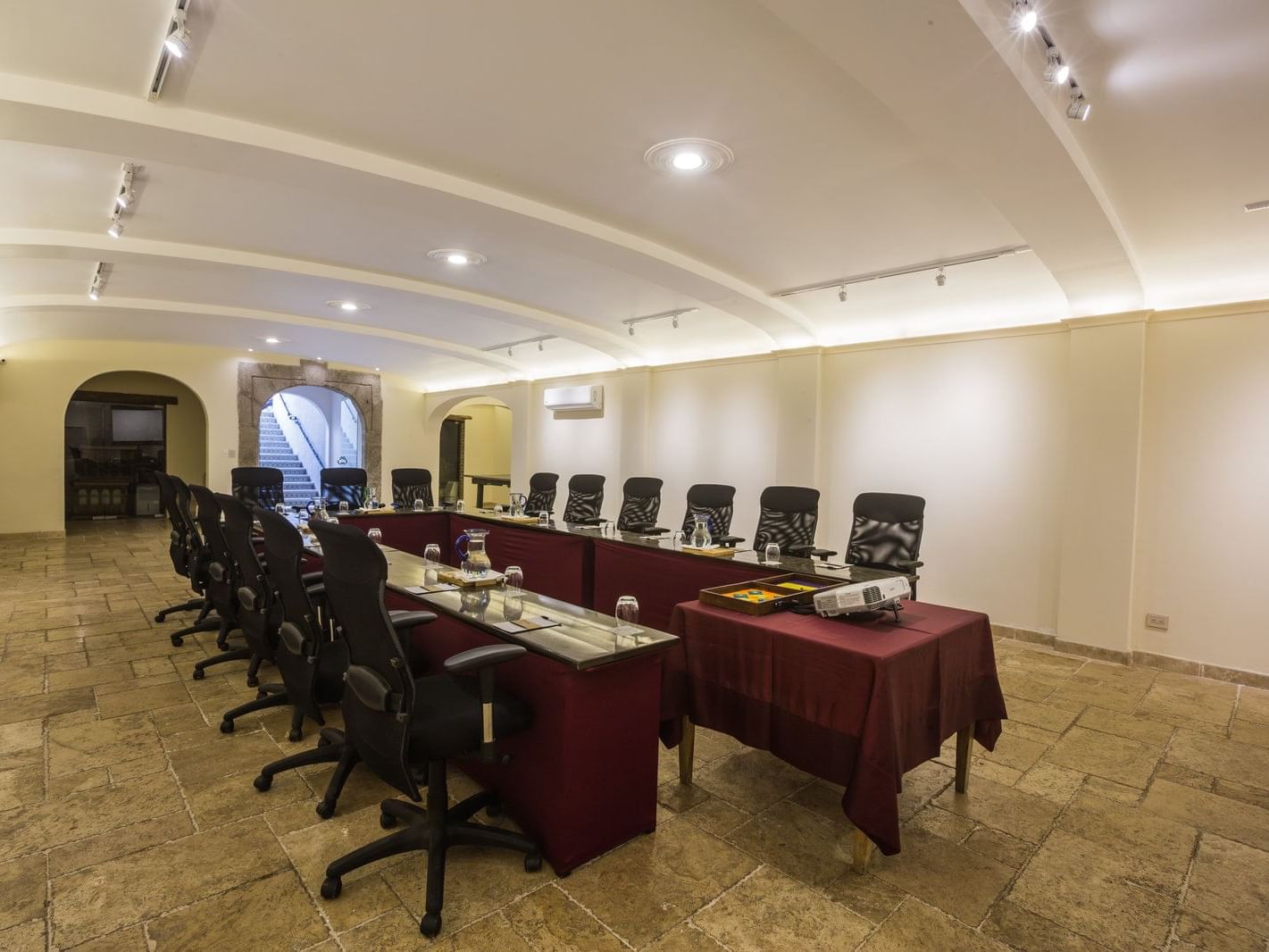 U-shaped table arranged for a meeting in The Study at Pensativo House Hotel