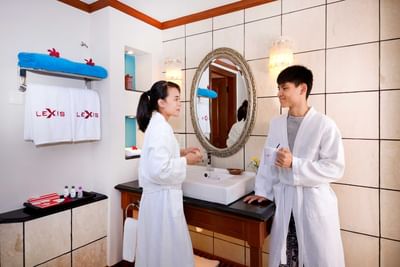 Couple in bathrobes enjoying a relaxed moment at Deluxe Pool Villa - Grand Lexis Port Dickson