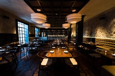 An elegant dining area in UNI restaurant at The Eliot Hotel