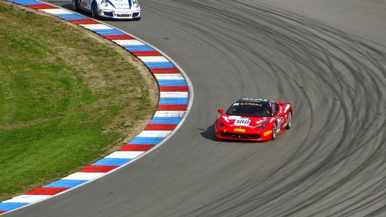 Cars racing at motorsports park