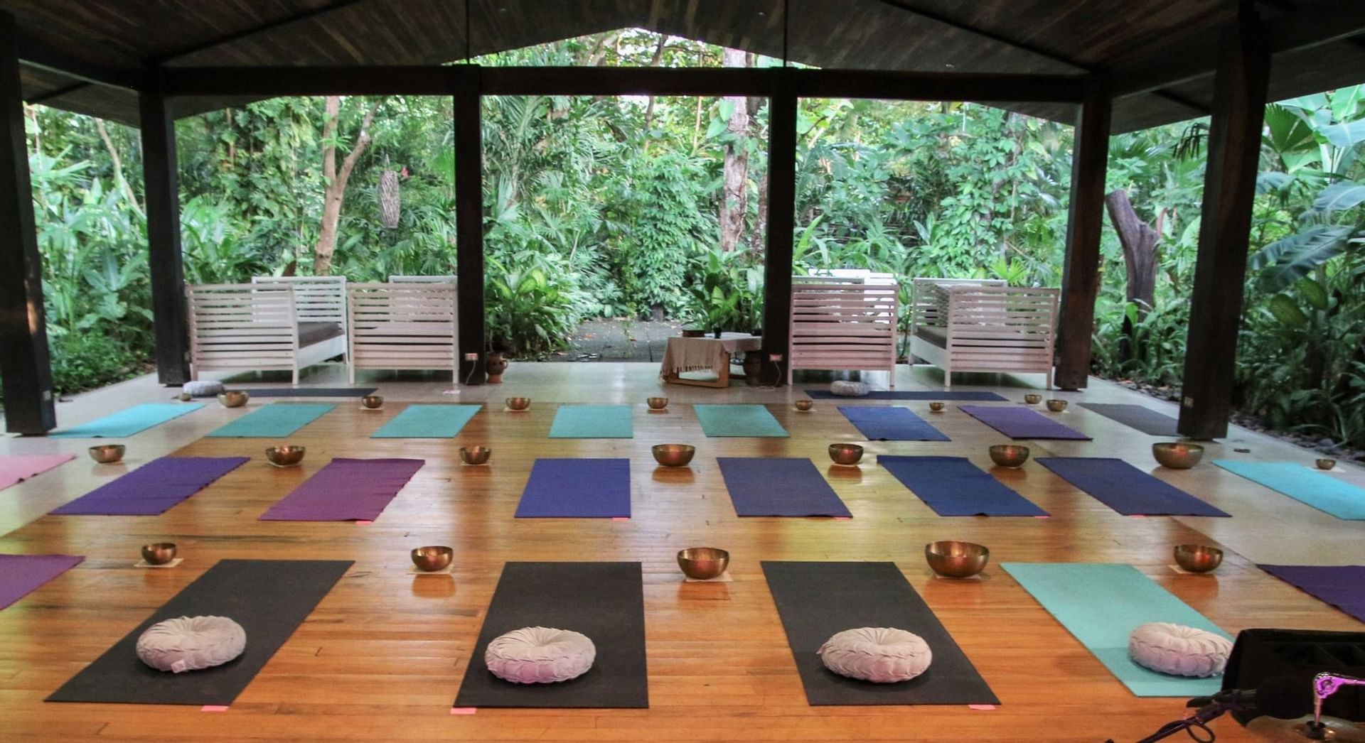 An open space with yoga mats at Cala Luna Boutique Hotel