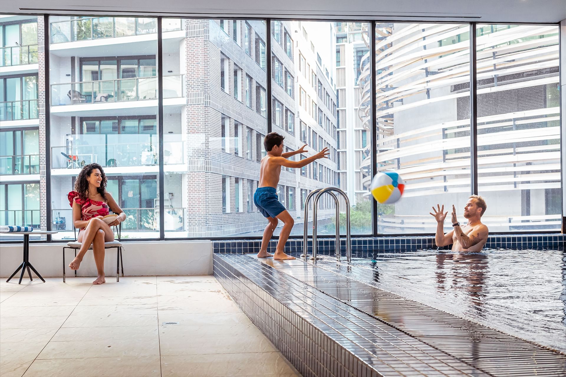 Family enjoying the indoor pool at Novotel Sydney Darling Square