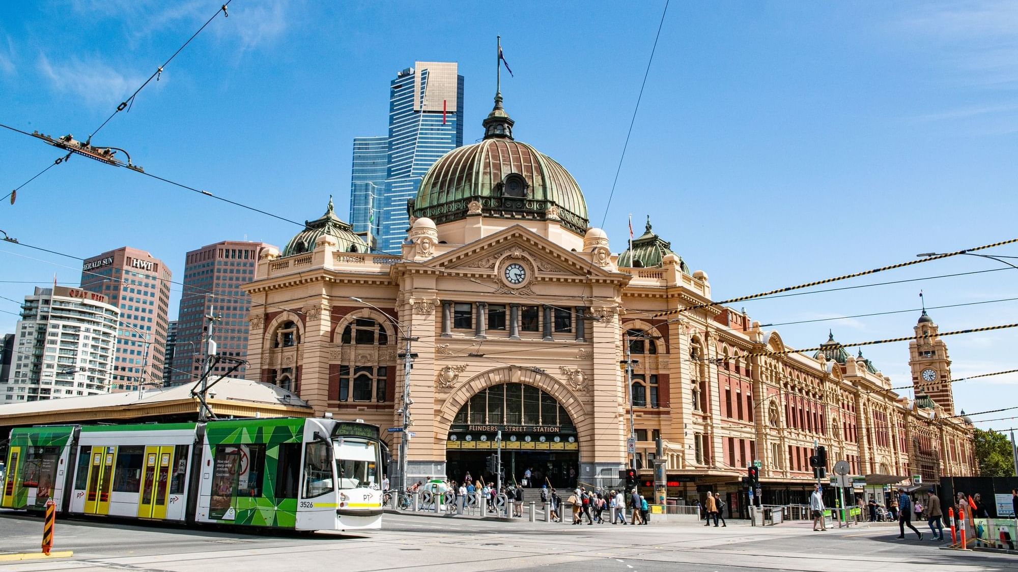 Low angle exterior view of Flinders Street Station near Quay West Suites Melbourne