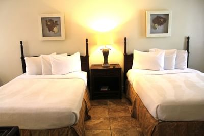 Double beds and nightstand in Ocean Breeze Deluxe Suite at Ocean Lodge Boca Raton