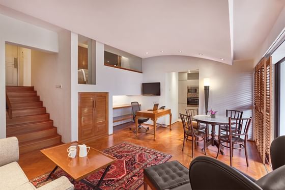 Parklane Split-Level Studio living room with staircase, sitting and work area at Goodwood Park Hotel