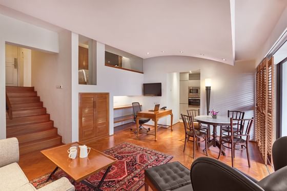 Parklane Split-Level Studio living room with staircase, sitting and work area at Goodwood Hotel