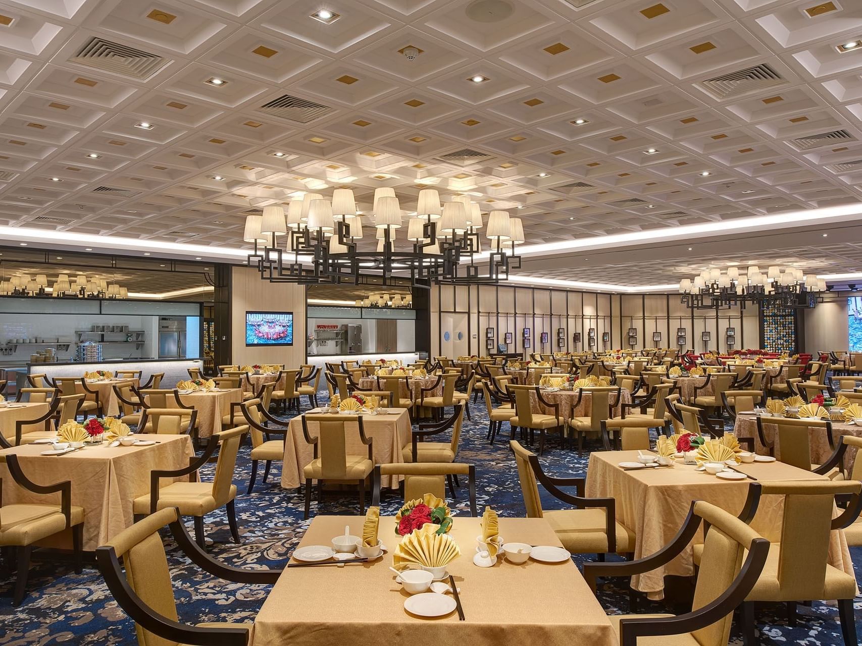 Zuan Yuan Chinese Restaurant featuring blue carpet & brown interior at One World Hotel