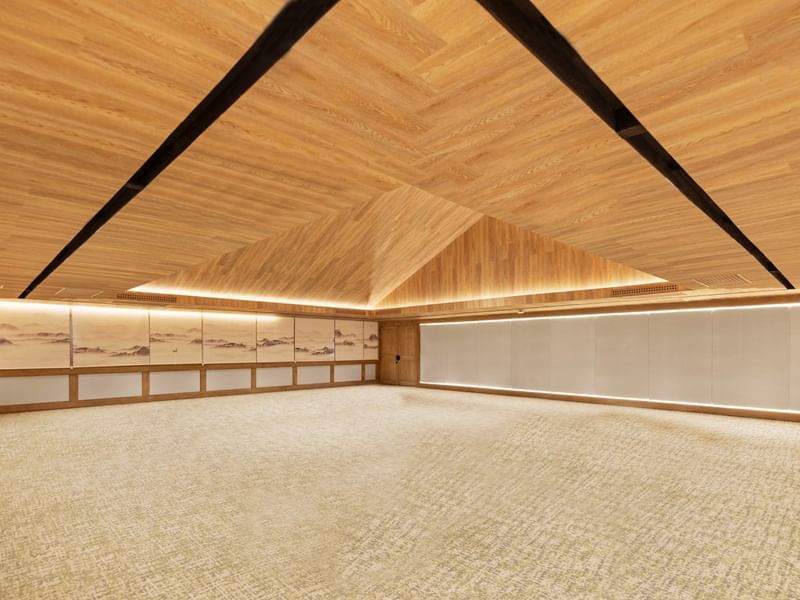 Large empty room with wooden ceiling and walls at Grand Fiesta Americana Sumiya Cuernavaca.