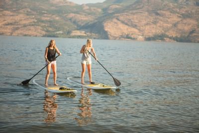 Duo on paddleboards on the lake