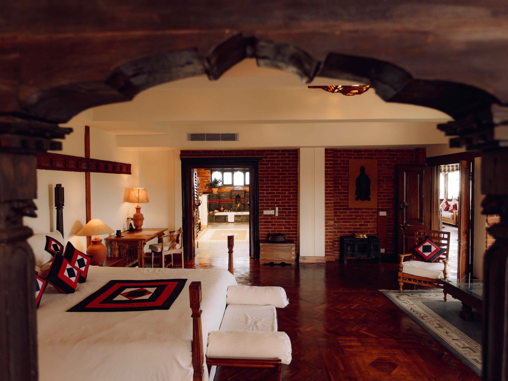 Spacious, elegantly designed bedroom in Royal Suite with wooden accents at Dwarika's Hotel Kathmandu