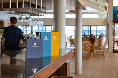 Bar counter area with three cards on it at Heron Island Resort