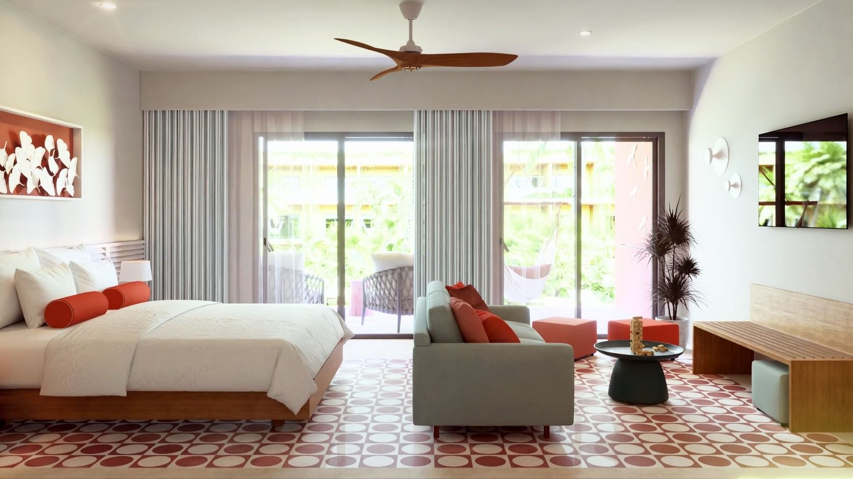 Junior Suite Pool Level espaciosa con sofá gris y balcón tropical en Fiesta Americana Funeeq Punta Cana