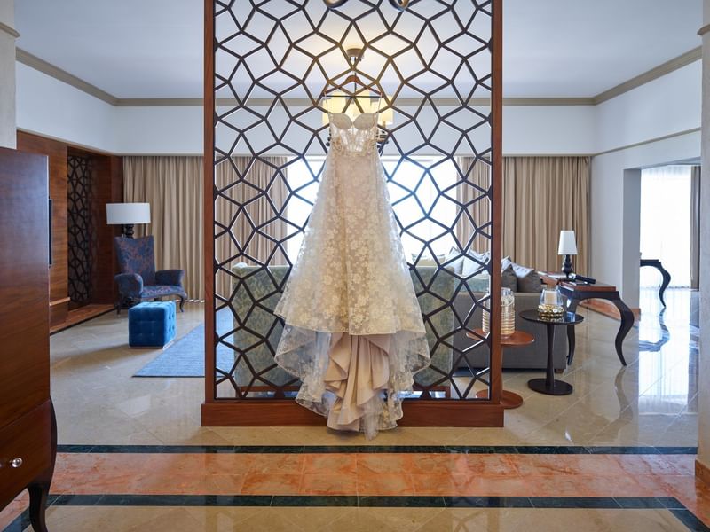 A bridal dress hanging in the Presidential Suite at FA Hotels