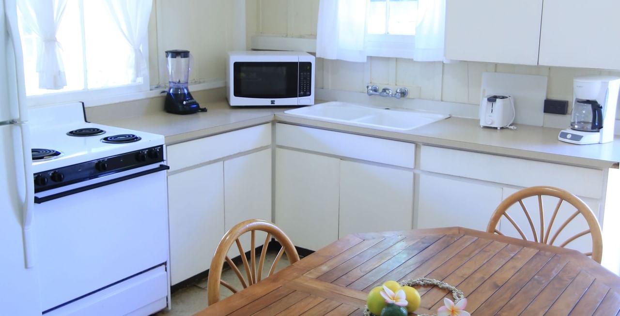 Kitchen appliances, table, and chair