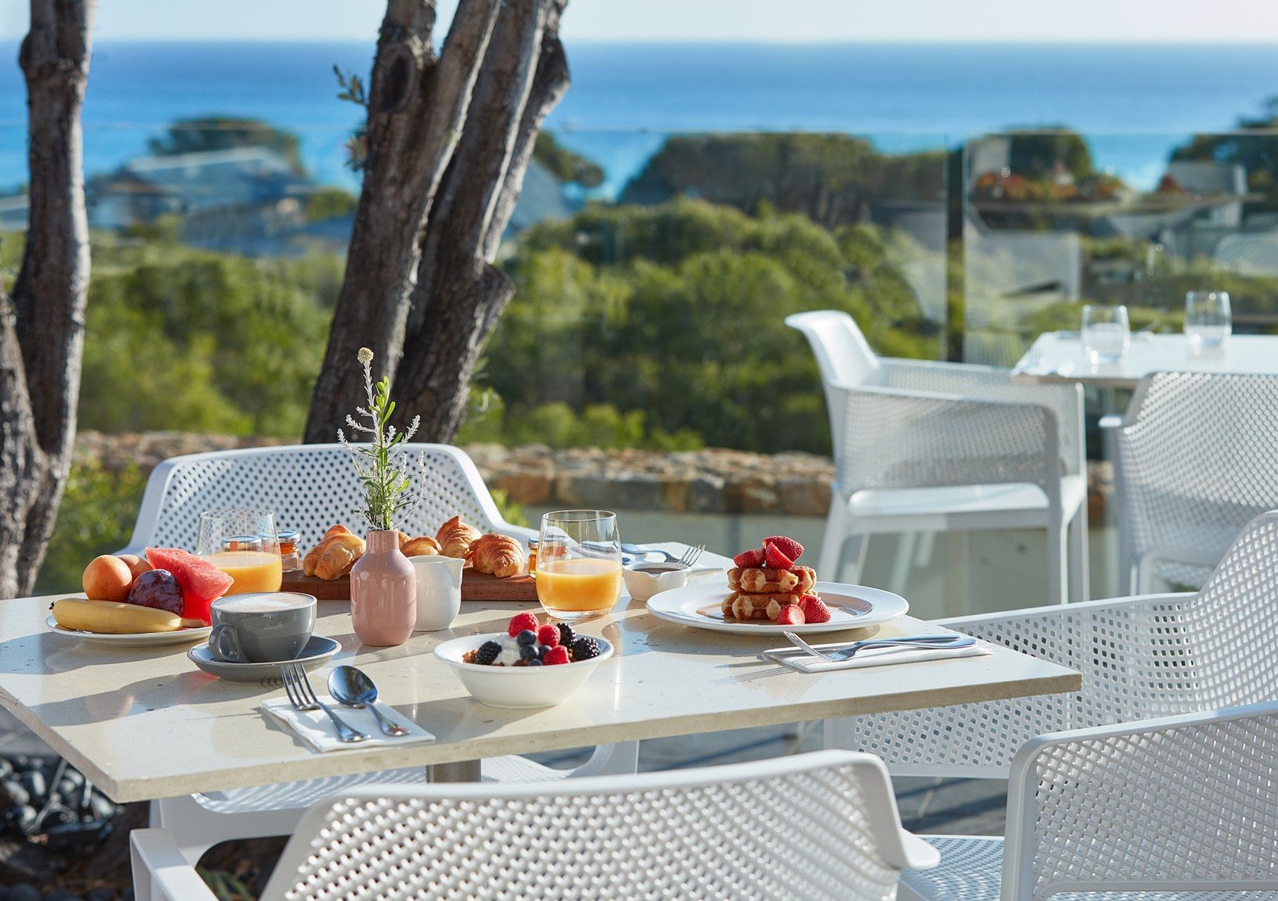 Outdoor dining tables at Pullman Bunker Bay Resort