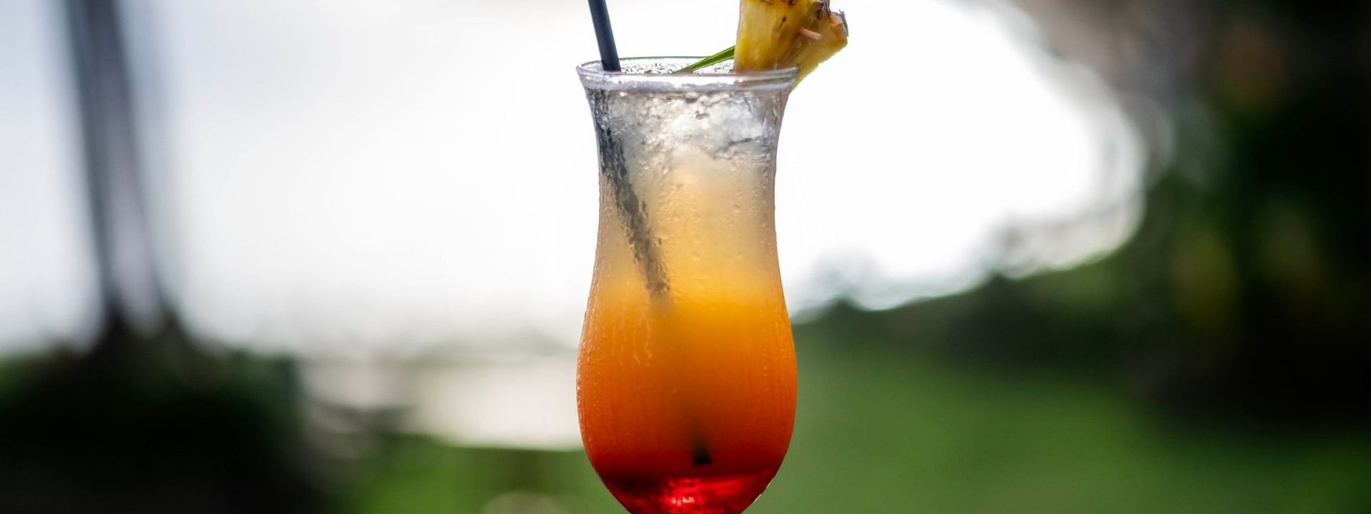 Tropical cocktail with a pineapple garnish at Sunset Bar in Korolevu at The Naviti Resort