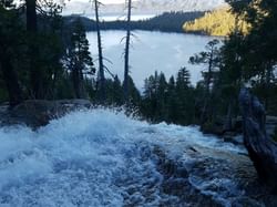 Cascade Creek Falls from top with Cascade Lake below and Lake Tahoe beyond