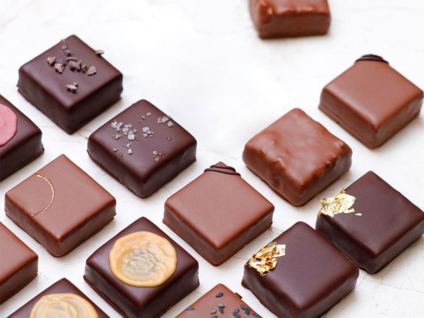 An assortment of gourmet chocolate squares with various toppings served in Chocolaterie at Park Hyatt Saigon