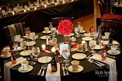 Round table set elegantly with charcoal highlights