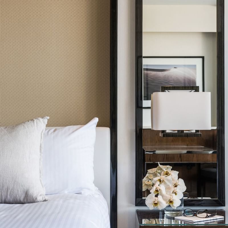 Close-up of a bed & mirror in a bedroom at Crown Metropol Perth