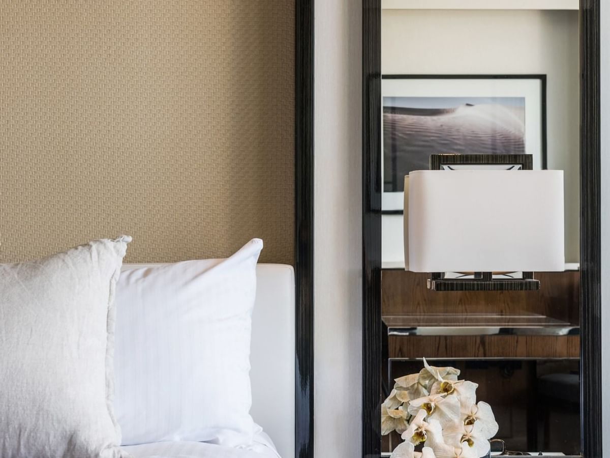 Close-up of a bed & mirror in a bedroom at Crown Metropol Perth