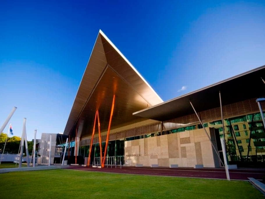 Exterior of Perth Convention and Exhibition Centre with lawn near Melbourne Hotel Perth