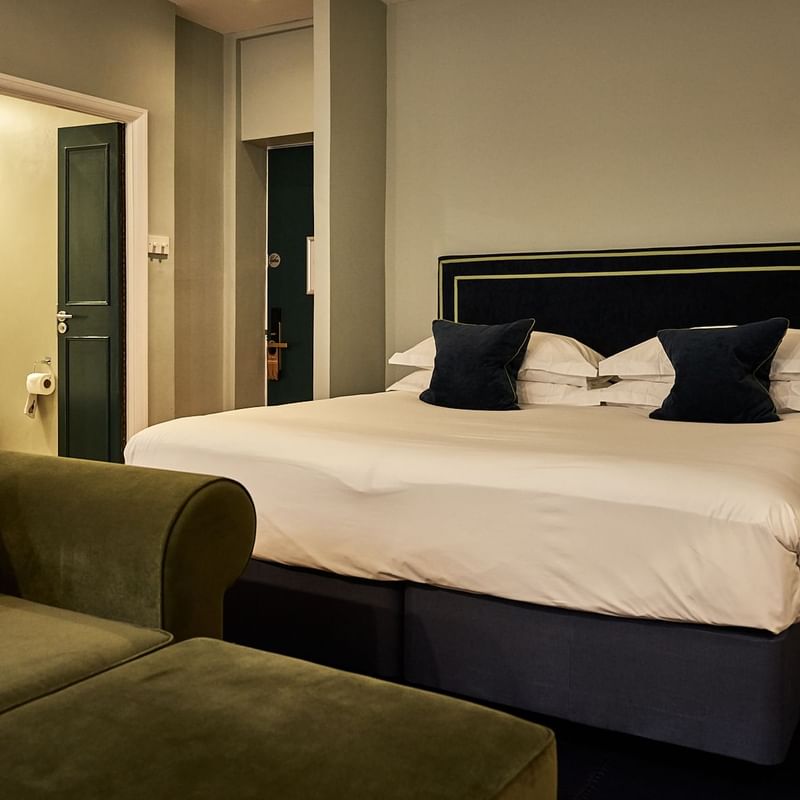 Renovated apartment with bed and sofa at the Capital Hotel London