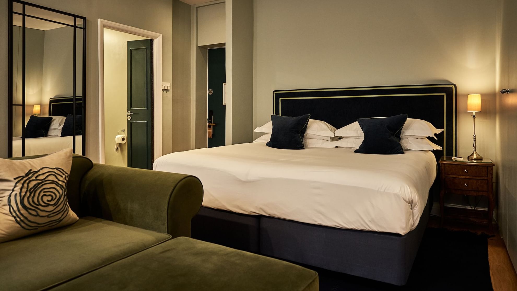 Renovated apartment with bed and sofa at the Capital Hotel London