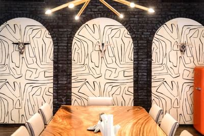 Conference-type event room set-up featuring a meeting table with chairs in the Business Center at The Riverwalk Plaza Hotel