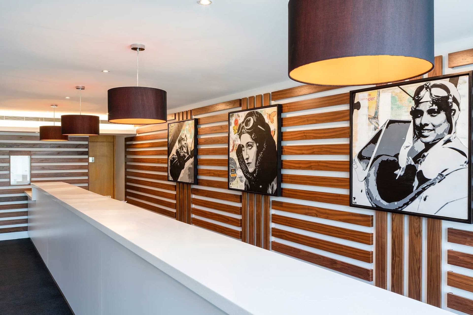 Reception counter in lobby area at St. Giles Heathrow Hotel