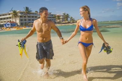 Couple holding hands on the beach near Holiday Inn Montego Bay