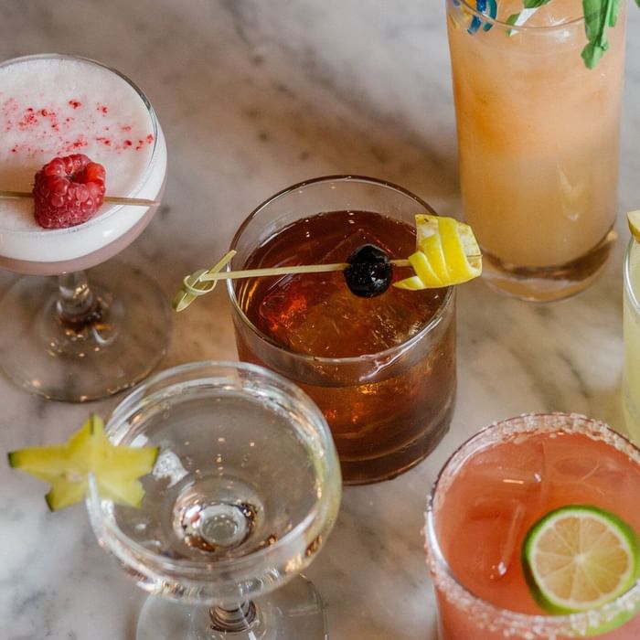 Variety of cocktails served on a marble surface in STELLA at Hotel Sorrento