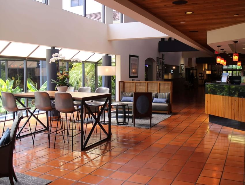 Hotel lobby with spacious patio and floor-to-ceiling windows at Miami Lakes Hotel