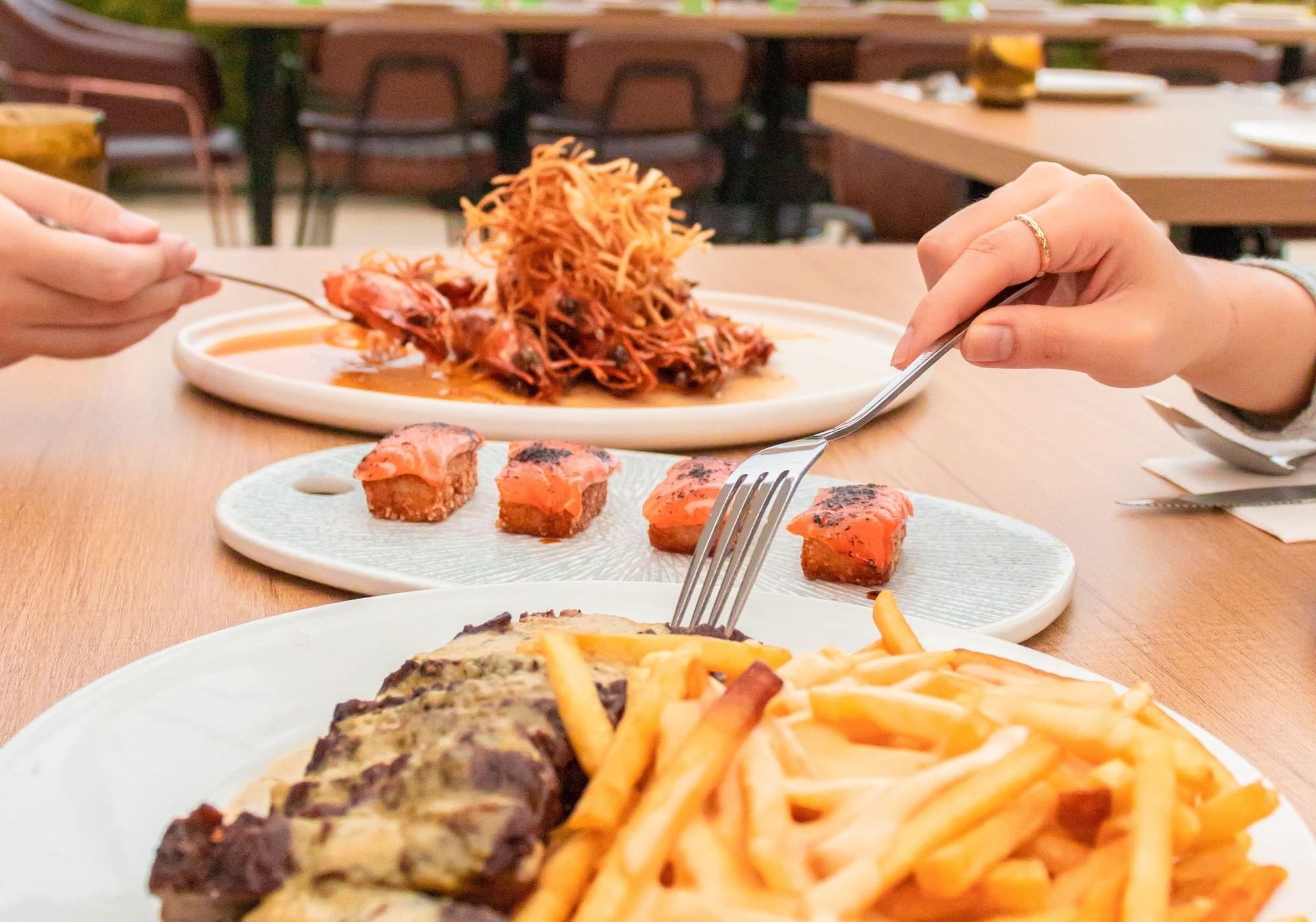 A couple enjoying steak and fries in Sunway Boulevard 88 at Sunway Hotel Big Box