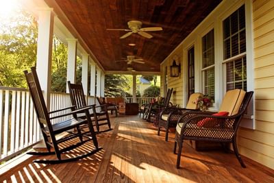 Porch with rocking chairs, ceiling fans at The Inn at Willow Grove