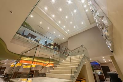 Interior of lobby with a glass staircase at MARlNN Place Financial District, 5 star hotels in Panama