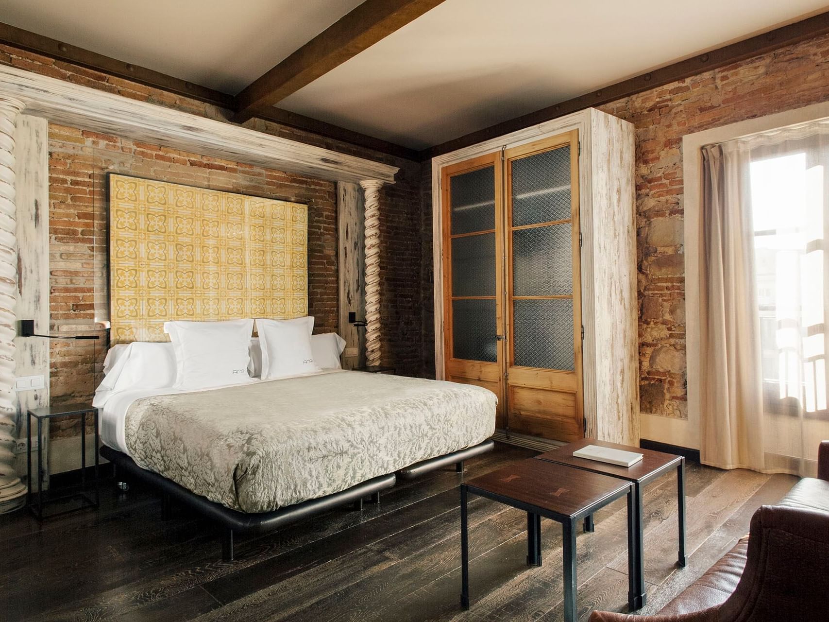 Bedroom arrangement in Deluxe Suite at Barcelona Apartment