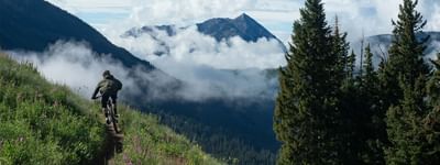 Man riding a mountain bike on a trail at Elevation Resort Spa