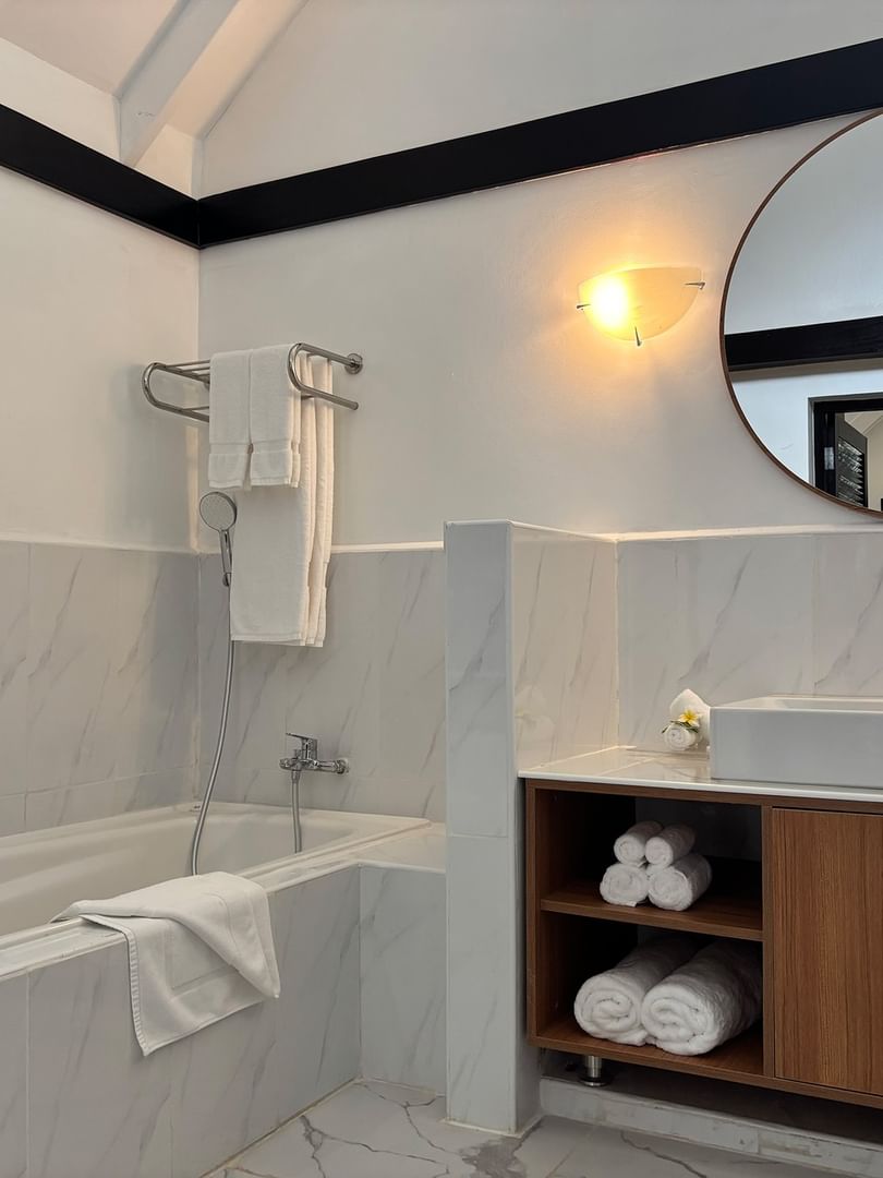 Elegant bathroom with bathtub and modern vanity at Warwick Le Lagon - Vanuatu in Efate.