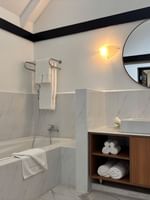 Elegant bathroom with bathtub and modern vanity at Warwick Le Lagon - Vanuatu in Efate.