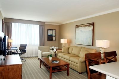 Living area with sofas & a TV in VIP Suite at Ethan Allen Hotel