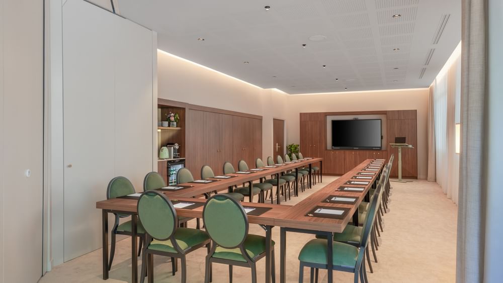 Long table with chairs in event room Warwick at Warwick Reine Astrid Lyon.
