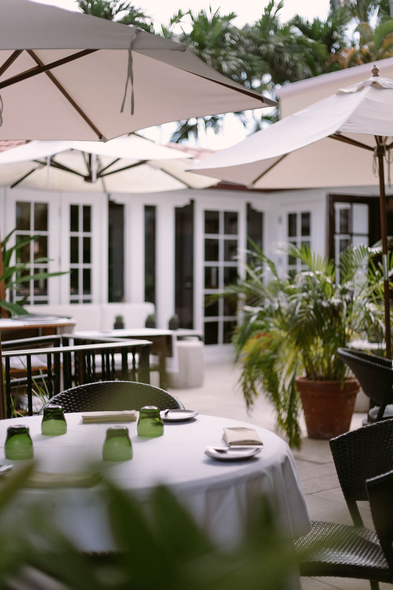 Outdoor dining table with umbrella at Brazilian Court 