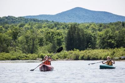 Two people kayaking on Schroon Lake Marina in The Lodge at Schroon Lake