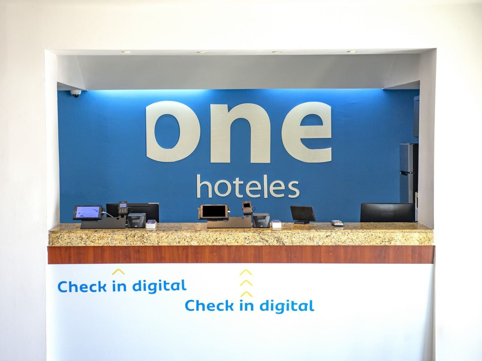 Digital check-in by the front desk at One Hotels