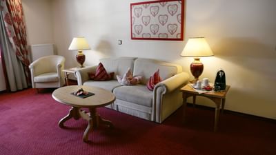 Sofa & a coffee table in Comfort Superior Suite at Liebes Rot
