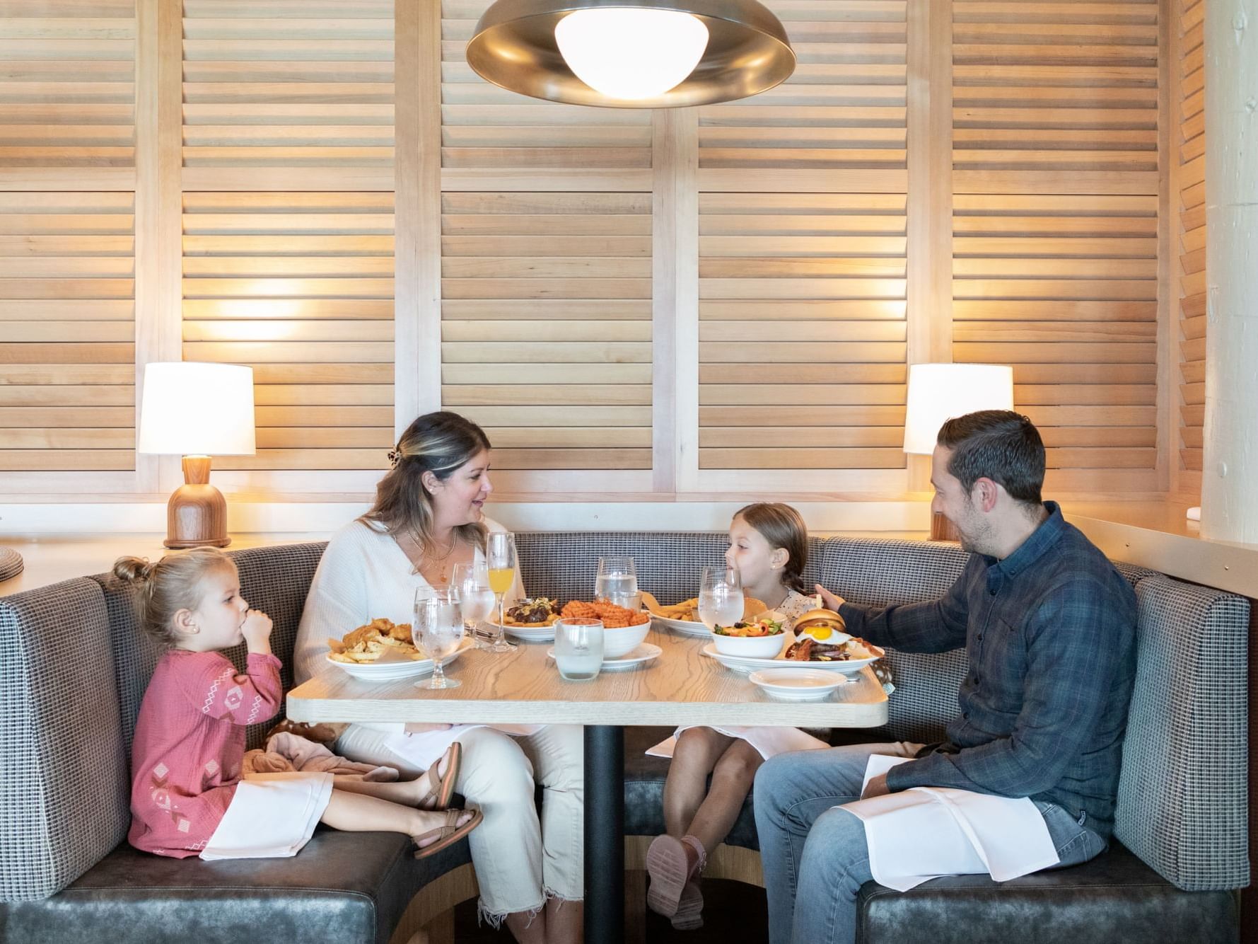 Family enjoying the dinner in the restaurant at Alderbrook Resort & Spa