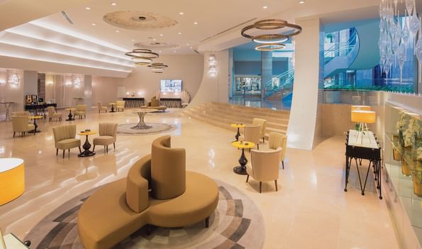 Pacific Meeting Hall Foyer with comfy chair and tables at Titanic Deluxe Lara